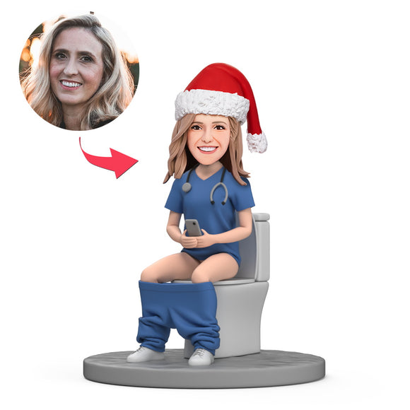 Female Doctor with Christmas Hat Sit on Toilet Custom Bobblehead with Engraved Text